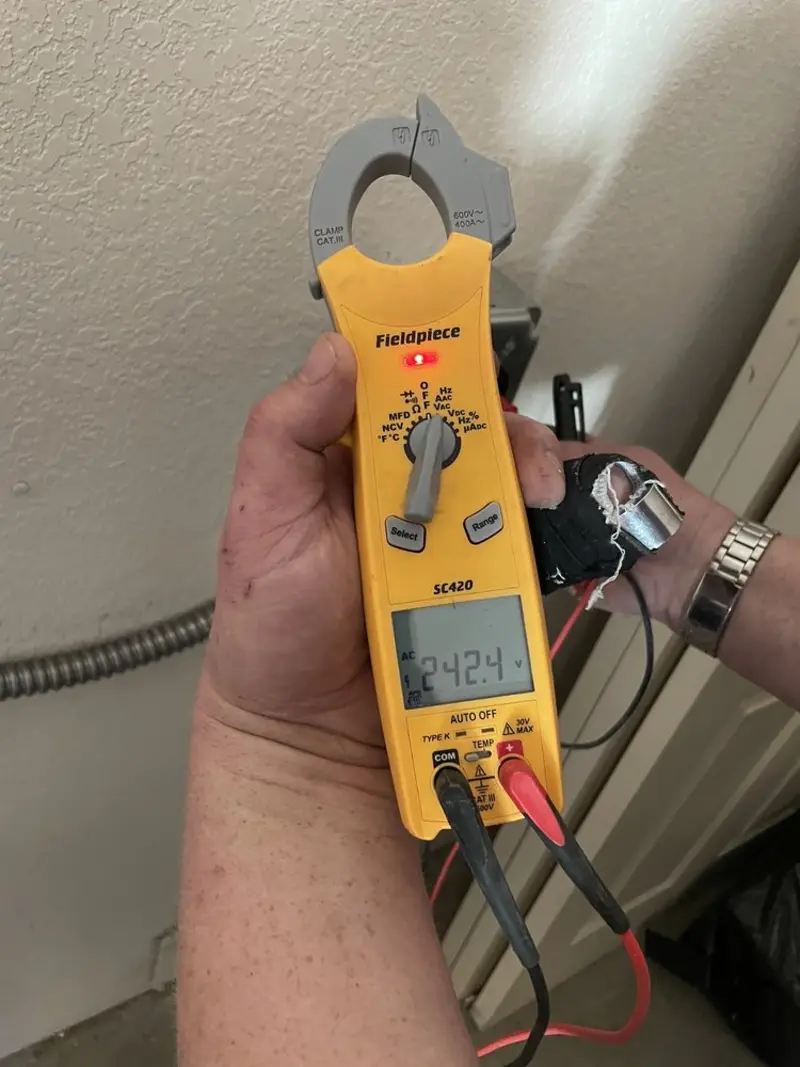 Voltage testing with clamp meter during Electrical Installation Services in Palmetto Bay